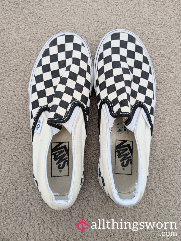 Checkerboard Vans With Dirty Footprints Inside