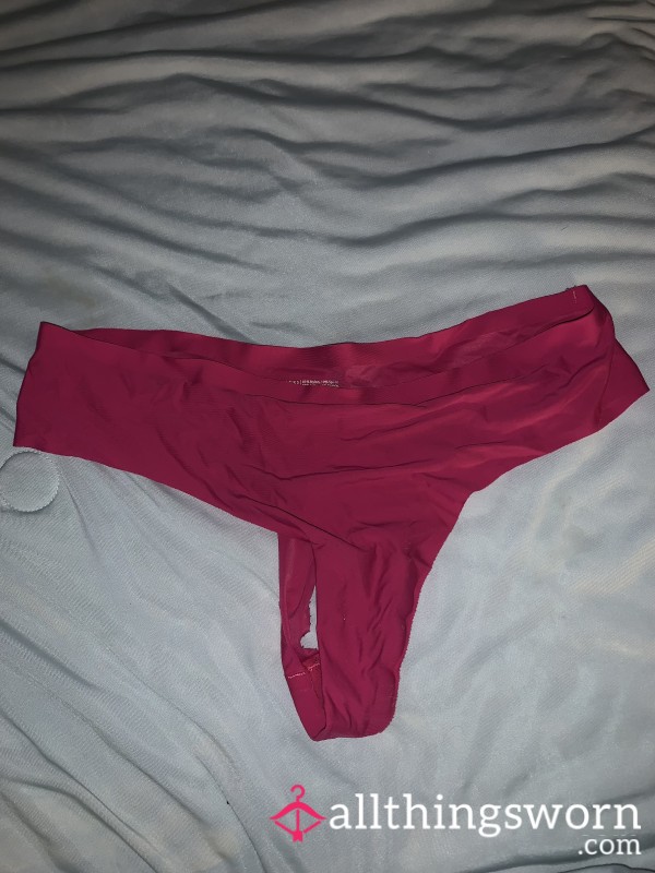 Hot Pink Spandex Thong With Slight Tear