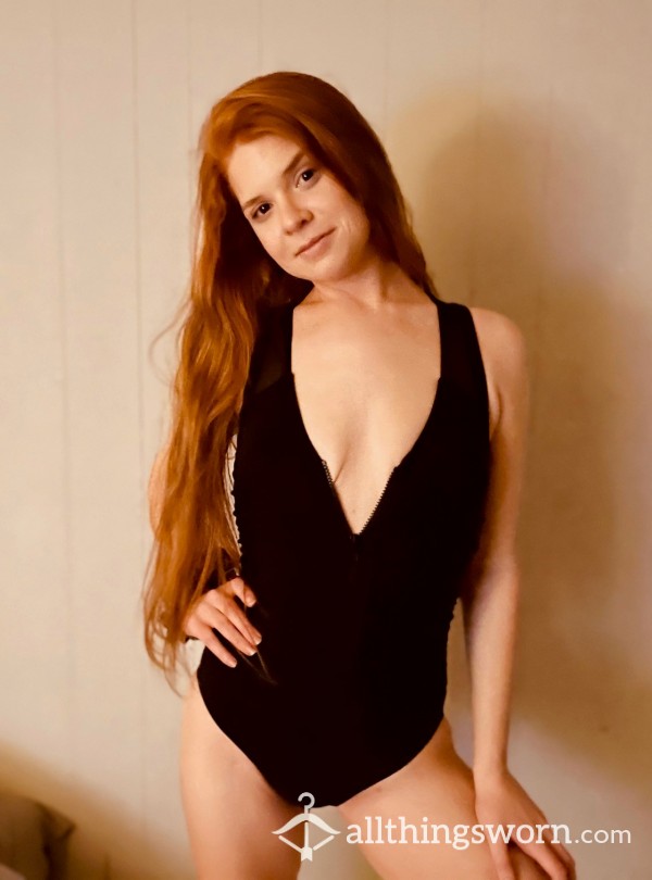 Sexy Black One Piece That Zips Down The Chest To Reveal The Ladies
