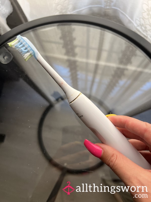 Used Electric Toothbrush Head (with Lipstick Marks)