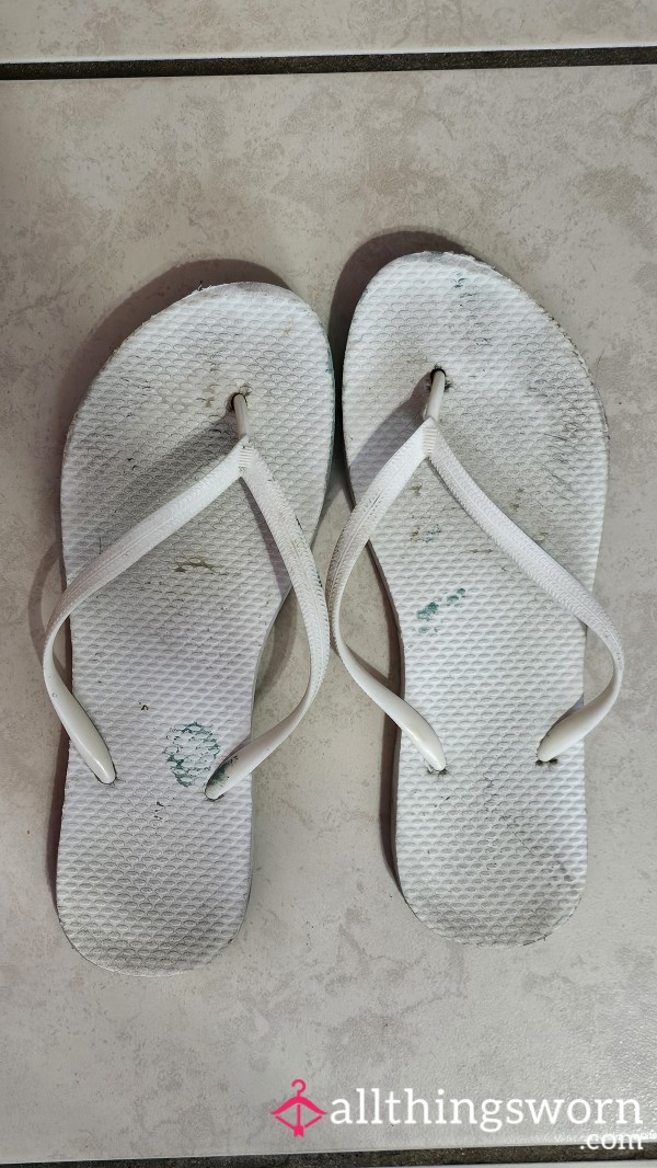 Well Worn Dirty White Flip Flops With Toe And Heel Prints