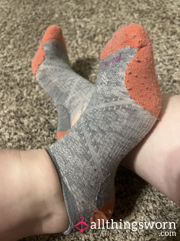 Well Worn Peach And Grey Smartwool Socks With Holes